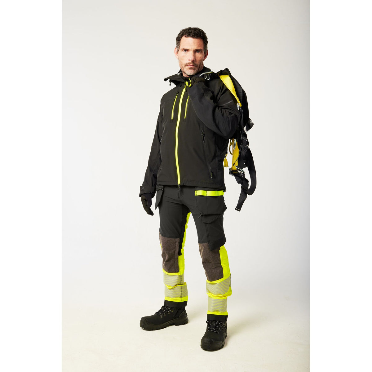 Portwest EV4 EV442 Hi-Vis Class 1 Stretch Holster Work Trousers in Yellow/Black, worn by a model